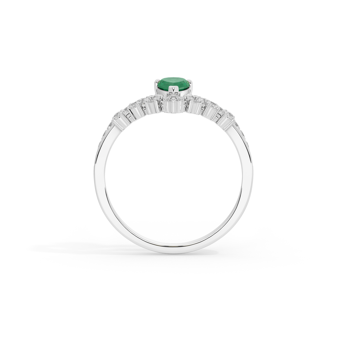Sterling silver ring with green emerald center stone and baguette-style diamond band