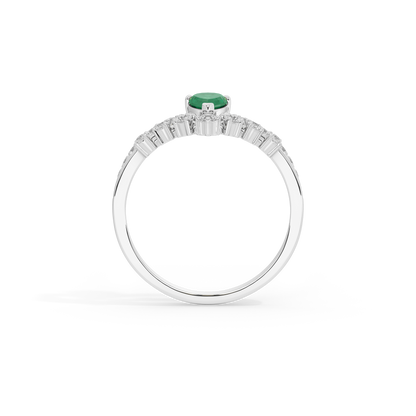 Sterling silver ring with green emerald center stone and baguette-style diamond band