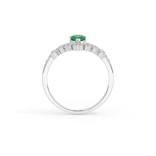 Sterling silver ring with green emerald center stone and baguette-style diamond band
