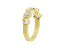 Gold ring with three diamond-like stones on a white background