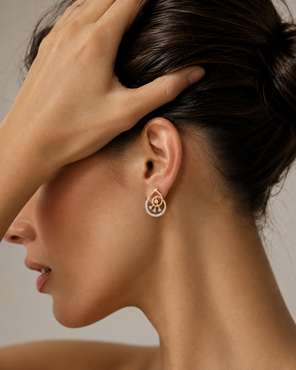 Yellow gold vermeil diamond drop earrings on ear, oval halo with dangling stones
