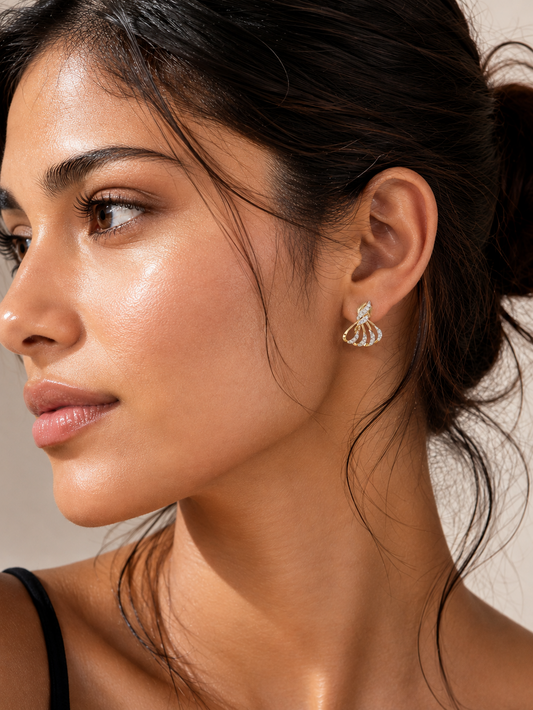 Woman wearing gold vermeil diamond fan drop earrings visible on her ear
