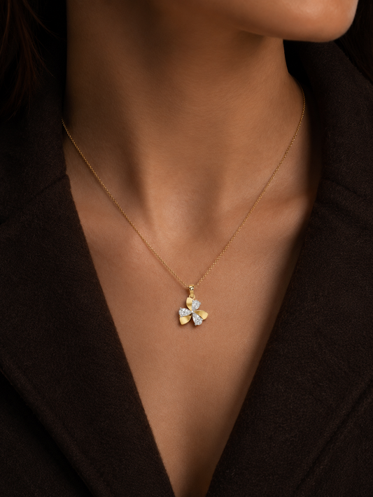 Yellow gold vermeil diamond pendant necklace on a model's collarbone