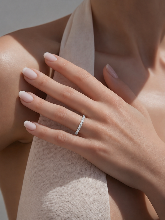 Cleo Eternity lab diamond ring on a hand, slim pavé band