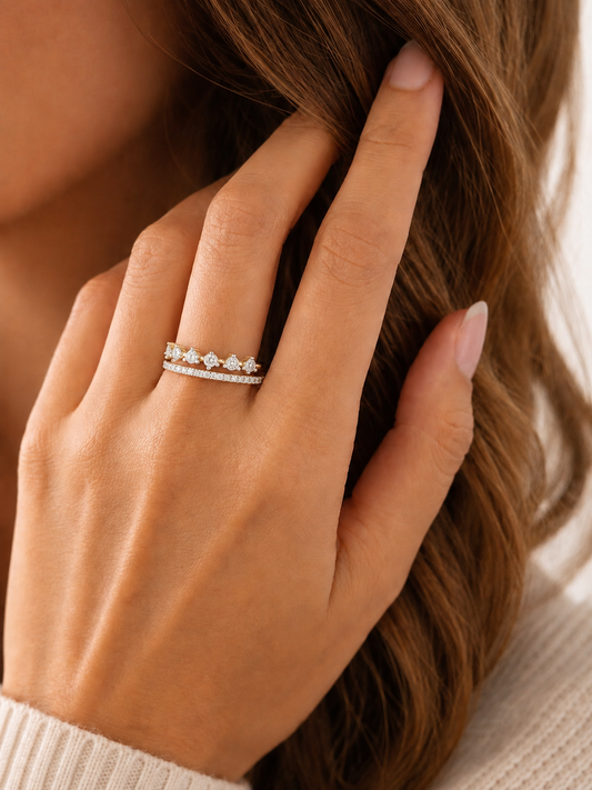 Yellow gold vermeil diamond ring on hand with slim band and small stones
