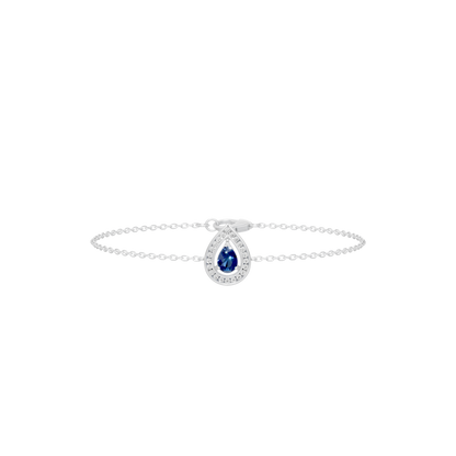 Sterling silver bracelet with blue oval center gemstone and circular halo