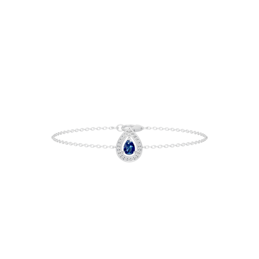 Sterling silver bracelet with blue oval center gemstone and circular halo