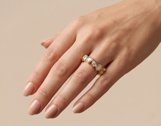 Yellow gold vermeil eternity band with bezel-set lab diamonds on model hand