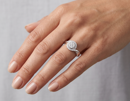 Sterling silver lab diamond ring on hand with round halo center stone