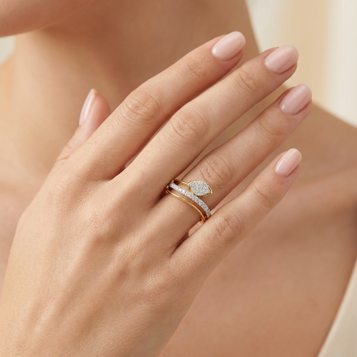 Yellow gold vermeil lab diamond ring worn on hand, oval bezel stones on curved band