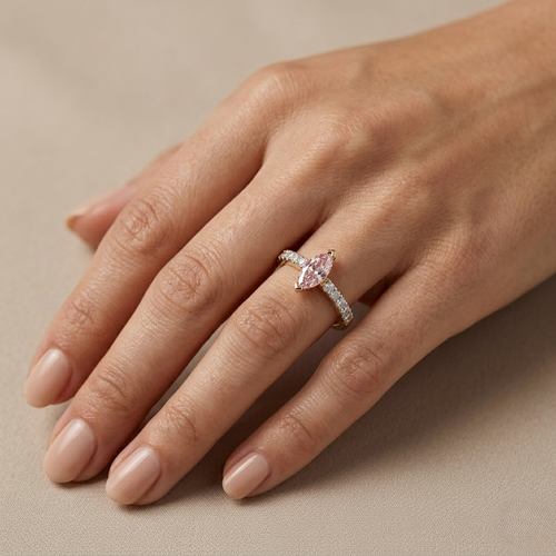 Lab diamond ring on hand: yellow gold vermeil band with pink marquise center