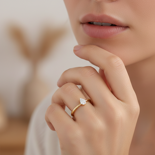 Yellow gold vermeil ring with small round lab diamond, worn on hand.