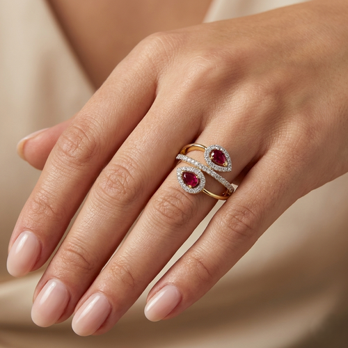 Lab diamond ring on hand with yellow gold vermeil band and two pink oval stones