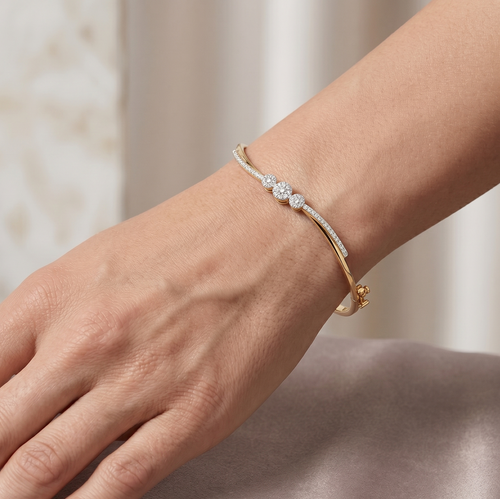 Yellow gold vermeil three-stone lab diamond cluster bracelet on wrist
