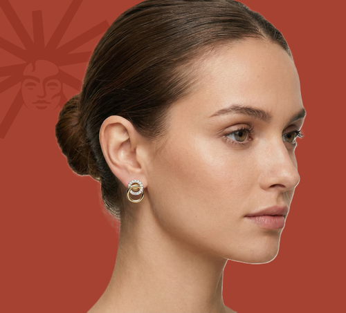 Gold vermeil loop link earrings worn on model, diamond ring detail